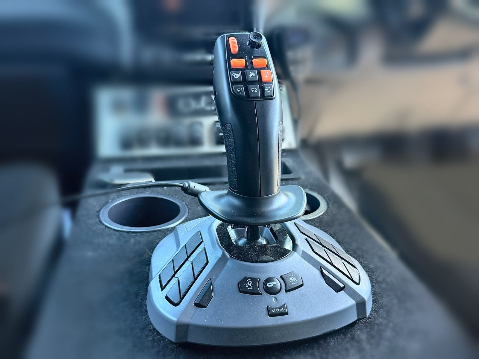 Feral Pro joystick on the centre console in the cab